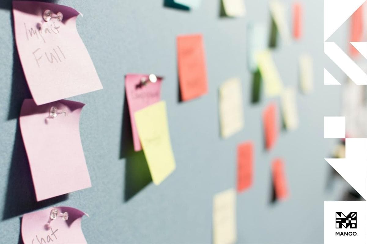A wall covered in colorful post-its
