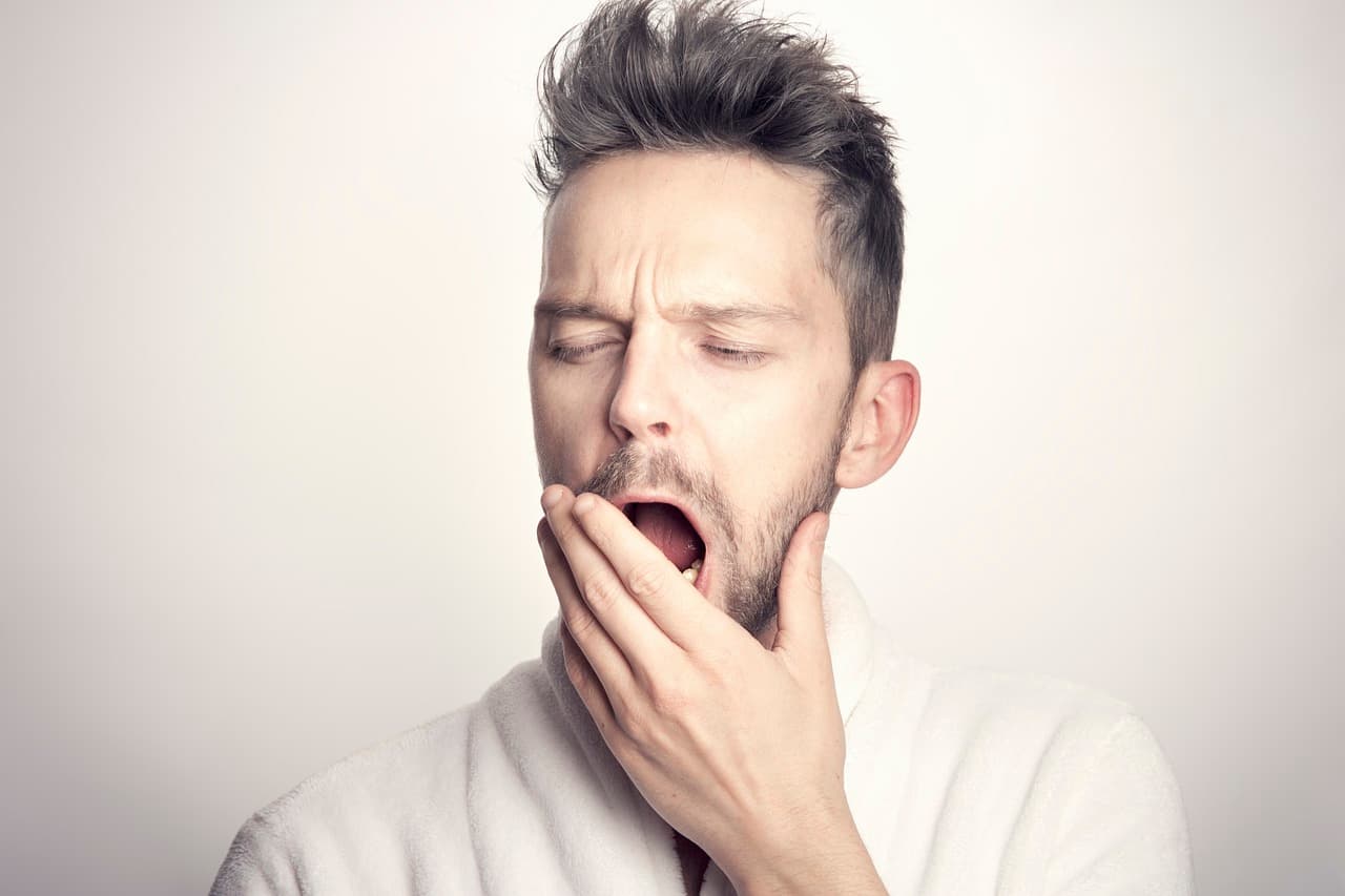 A photo of a man yawining.