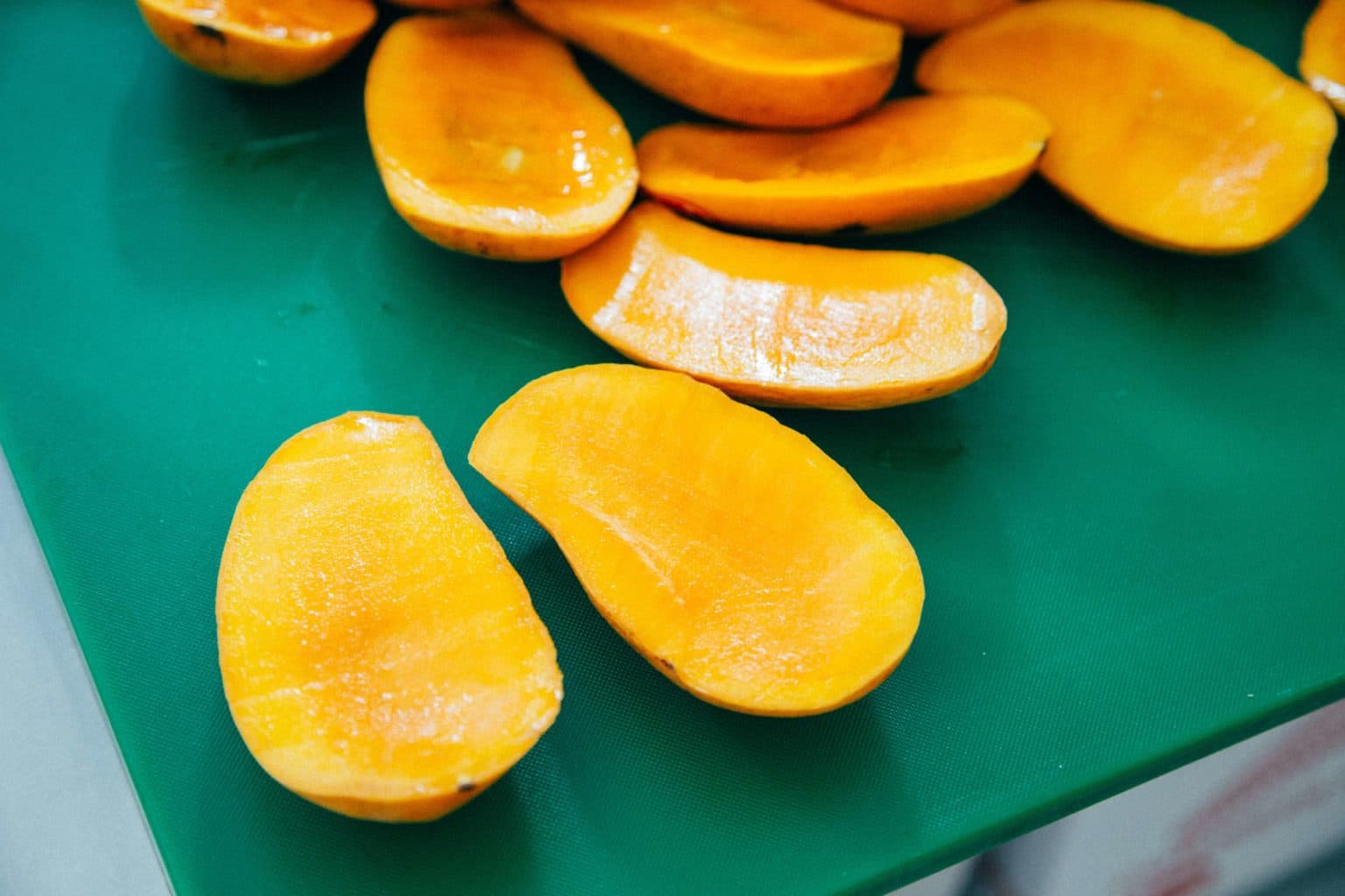 Mango slices on a cutting board