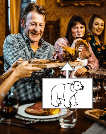 A man eating roasted bear meat