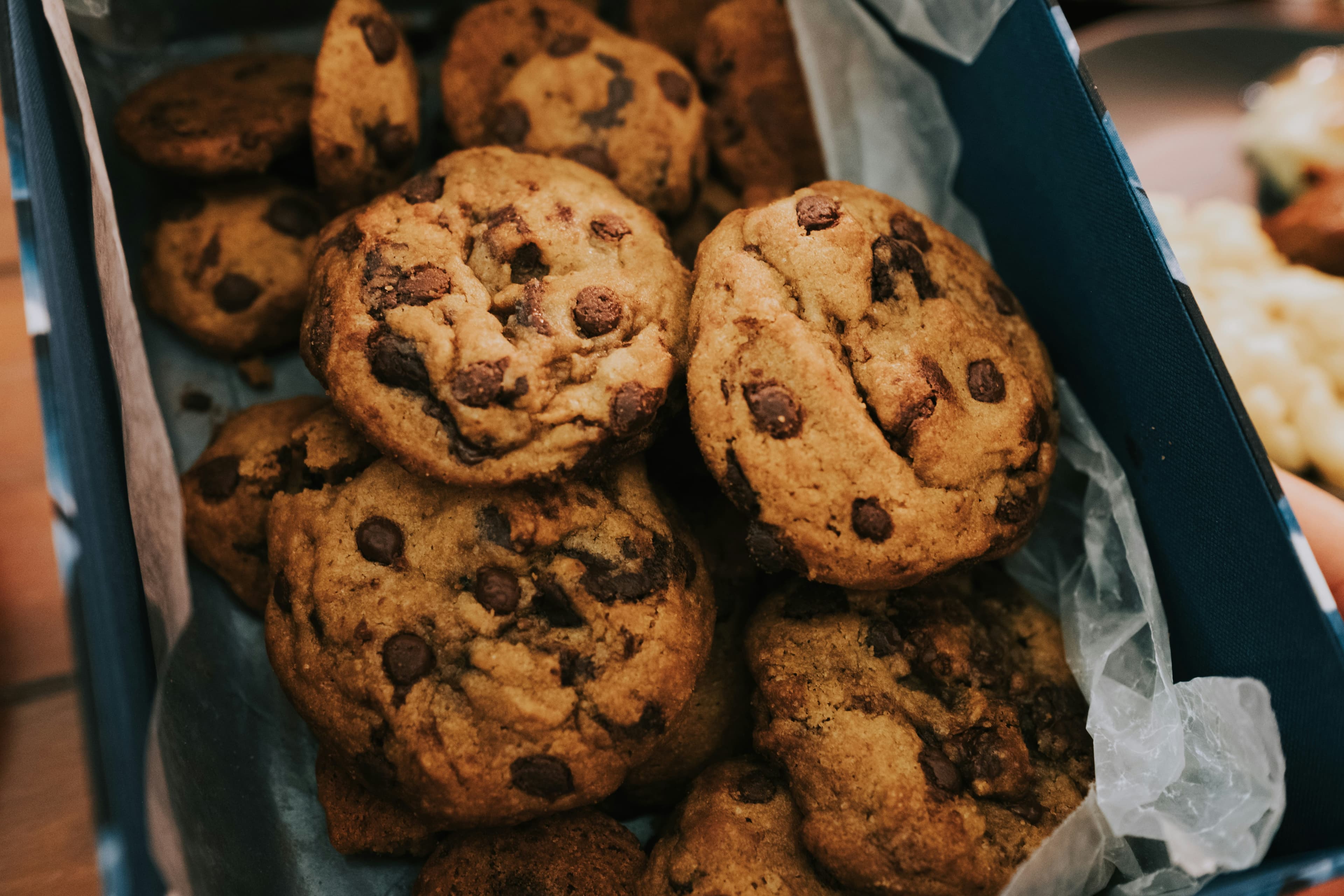 A photo of chocolate chip cookies in a box.