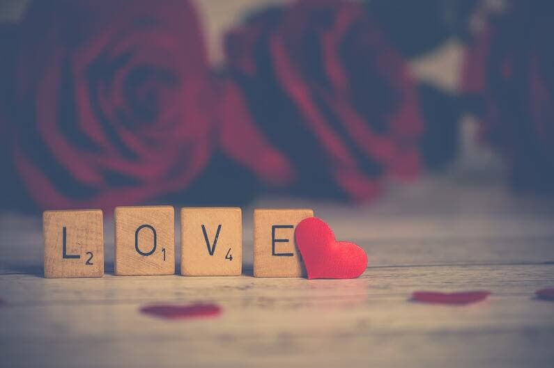 Scrabble tiles spelling the word "Love"