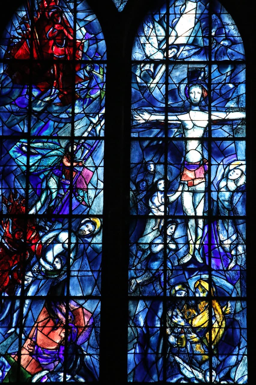 A photo of a blue stained glass window, created by Chagall.