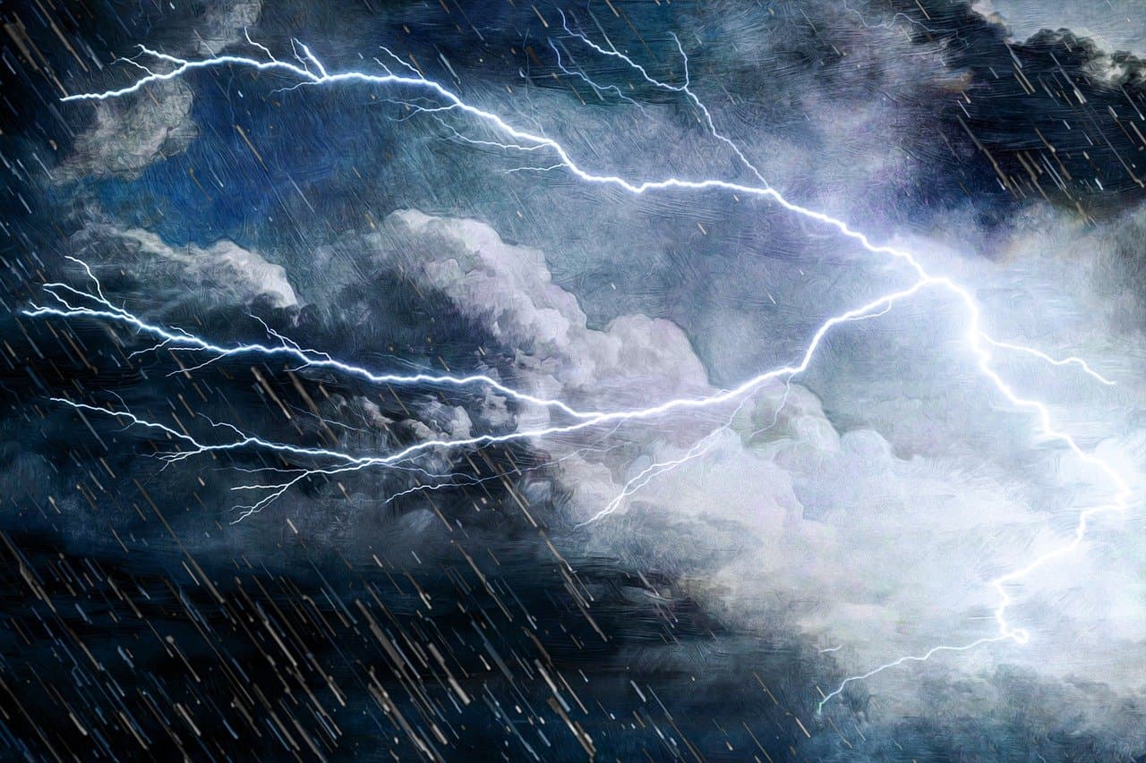 An image of a stormy sky with a fork of lightening crossing it.