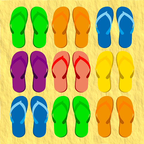 Nine pairs of flip flops in different colors.