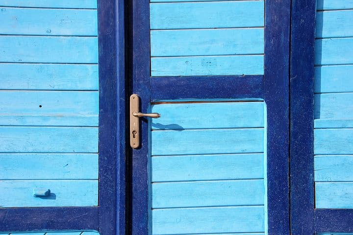a blue door slams shut
