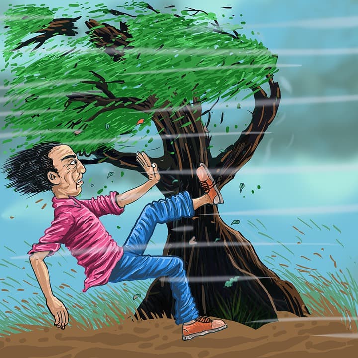 A graphic of a man being blown over by strong wind.