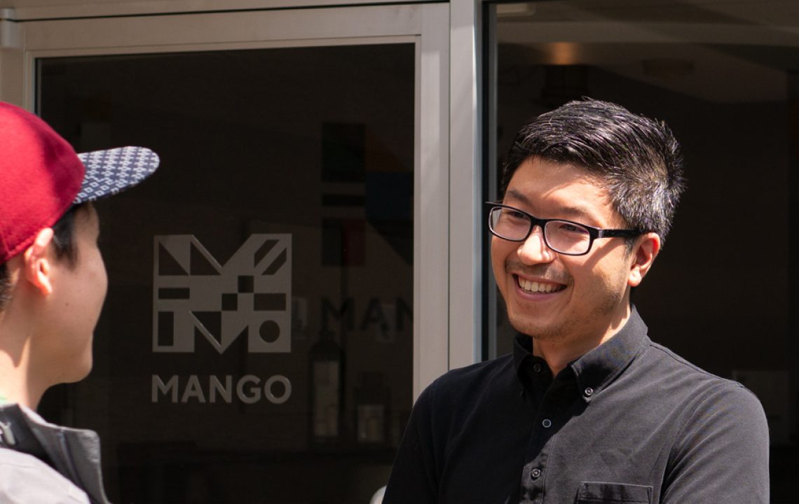 Two Mango Languages team members talking outside the Mango office